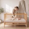 VERA Cot Bed – story time together VERA Cot Bed with parent and child
